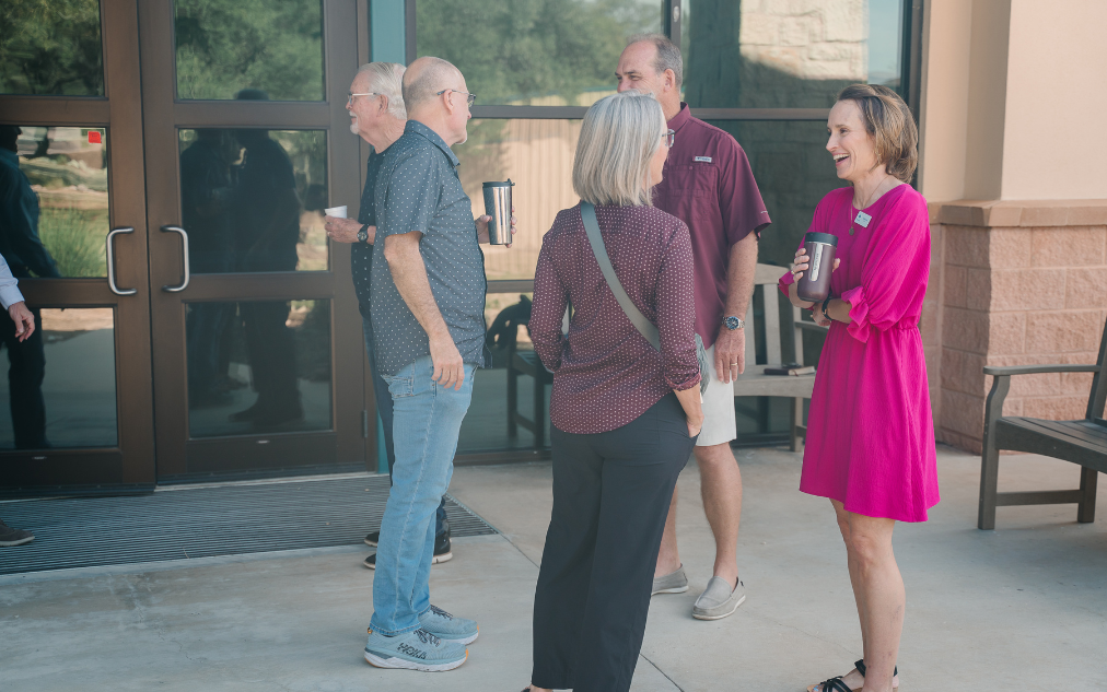 Adults connecting with one another at Christ Community